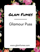 A product label for 'Glamour Puss' perfume and body oil by Glam Fumes, featuring a floral design with pink and red flowers and the product name prominently displayed.